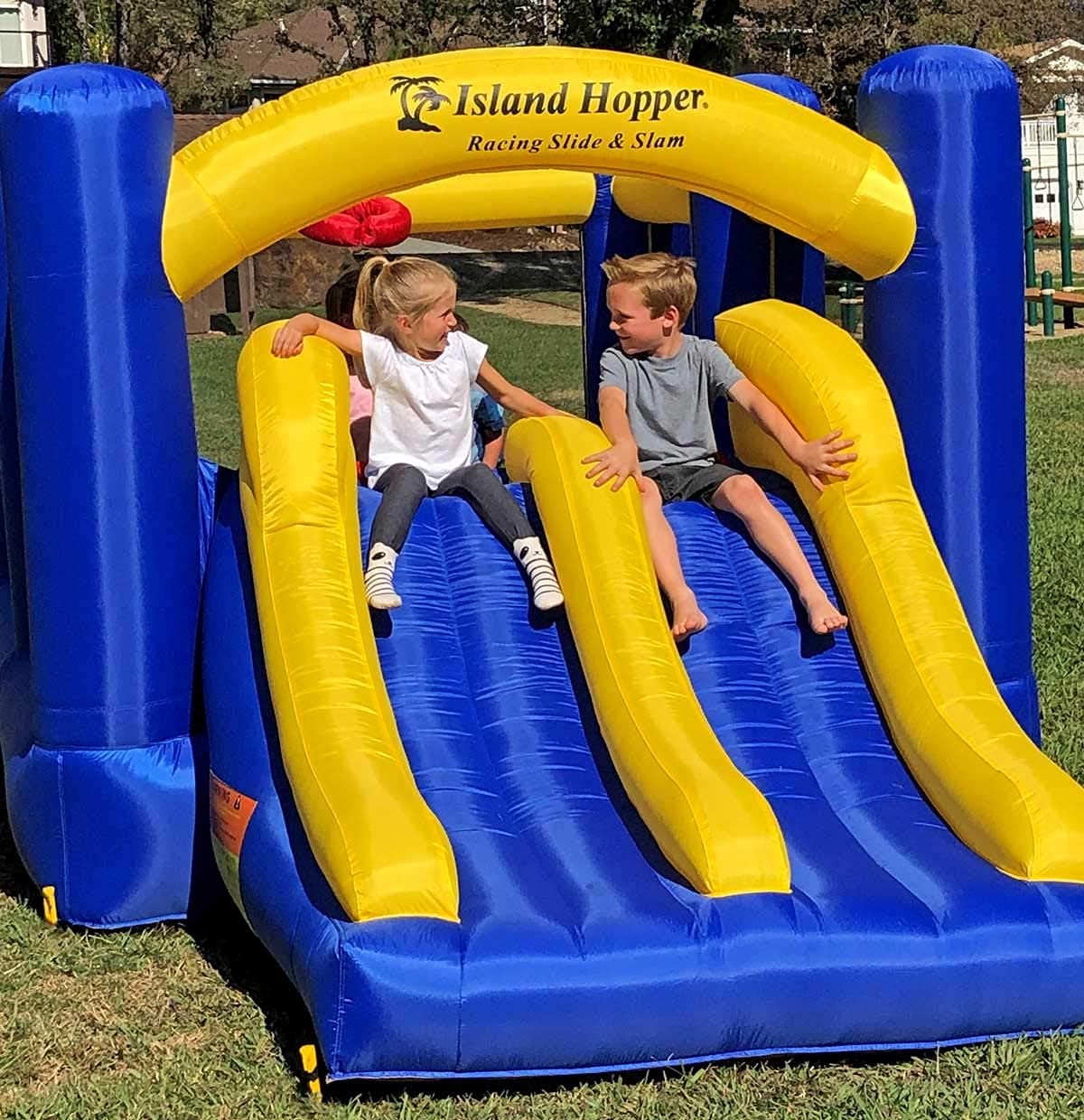 Island Hopper Racing Slide and Slam Inflatable Bounce House - Dual Slides, Climbing Wall & Basketball Hoop for Fun - Jumper with Durable PVC Build