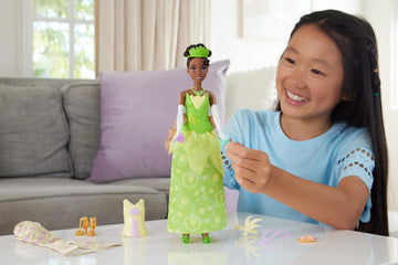 Mattel Disney Princess Toys, Tiana Fashion Doll with 2 Looks, 9 Accessories, 2 Snap-On Bodices & 2 Skirts, 2-in-1 Stories Inspired by Disney Movie