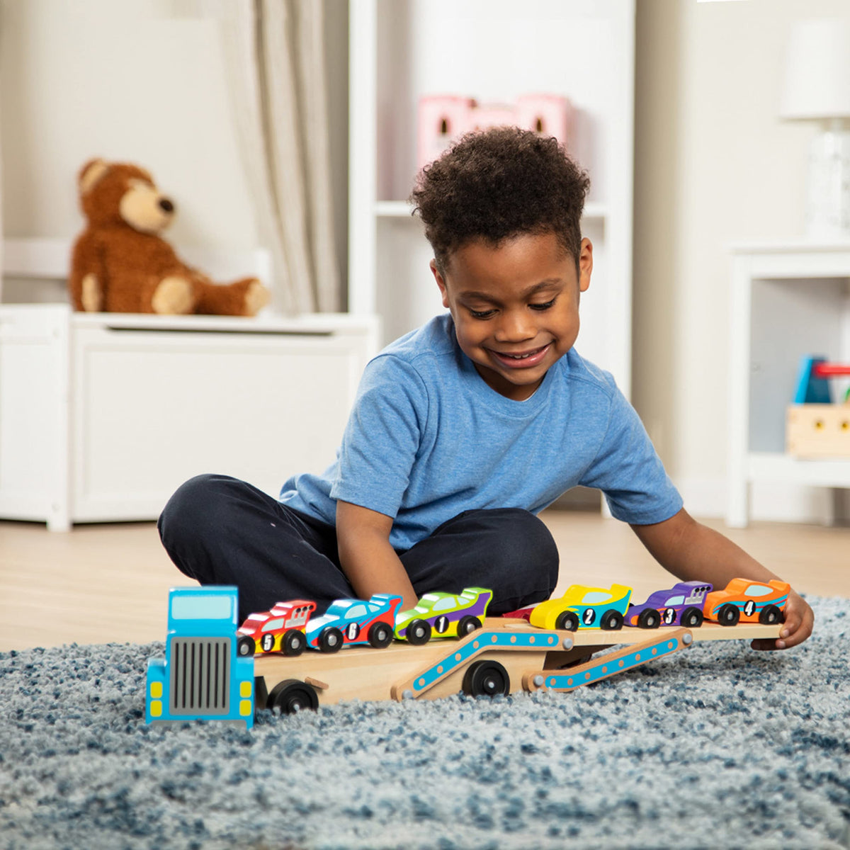 Melissa & Doug Mega Race-Car Carrier - Wooden Tractor and Trailer with 6 Unique Race Cars