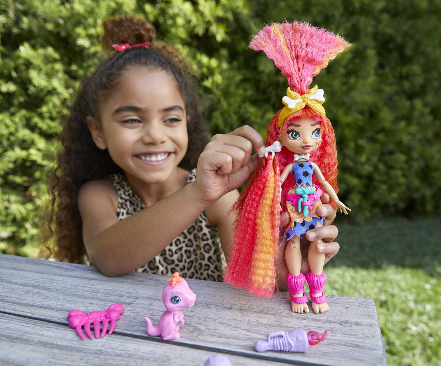Mattel Cave Club Emberly Doll (8-10-inch, Pink Hair) Poseable Prehistoric Fashion Doll with Dinosaur Pet and Accessories, Gift for 4 Year Olds and Up