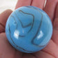 Big Game Toys Large 2" (50mm) Dinosaur Egg Toe Breaker Blue on Blue Swirl Glass Marble w/Stand