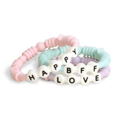Itzy Ritzy Teething Rings - Set of 3 Textured, Silicone Rings for Ages 3 Months & Up - One-Piece Design with Adorable Messages (Pastel)