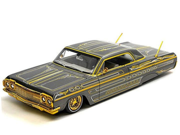 1964 SS Lowrider Gray Metallic with Gold Graphics Lowriders Design Series 1/26 Diecast Model Car 32547GRY