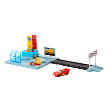 Disney and Pixar Cars On The Road Dinoco Rusteze Racing Center Playset with Lightning McQueen Toy Car, Launcher, Short Track and Spinning Pitty, Toy