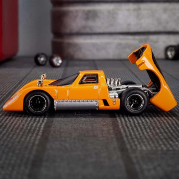 Hot Wheels Elite 64 McLaren M6GT 1:64 Die-Cast Collectible Model Car - McLaren Orange with Opening Rear Engine & Real Riders™ Wheels - Mattel