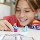 Polly Pocket Un-Box-It Playset, Popcorn Shaped Box Opens to a Movie Theater Adventure, 20 Accessories Including 2 Micro Dolls & 3 Tiny Takeaways