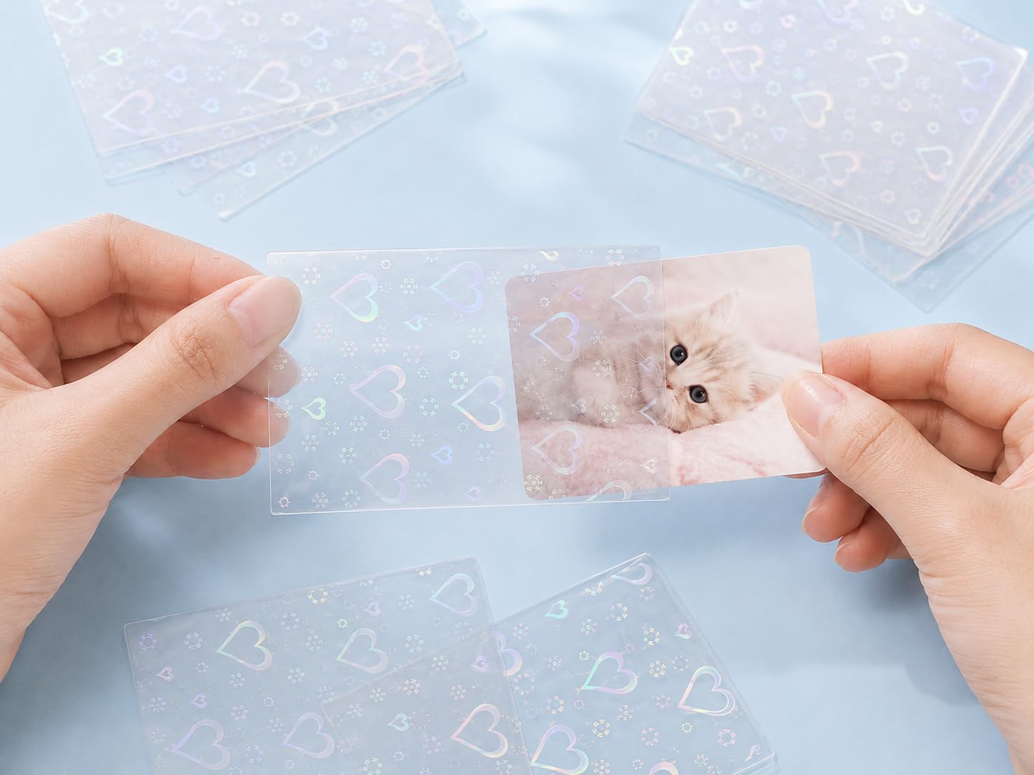 Kevvnza 200 Pcs Holographic Card Sleeves 65x91mm, Clear Kpop Photocard Sleeves, Laser Flashing Trading Card Protectors for Photo Cards, TCG, Sports