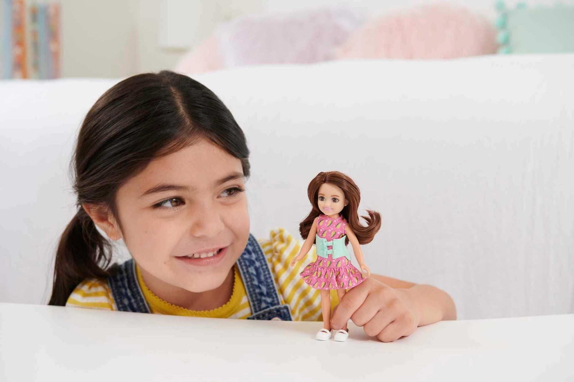 Barbie Chelsea Doll, Small Doll with Brace for Scoliosis Spine Curvature, Brunette Wearing Pink Lightning Bolt Dress
