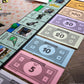 Monopoly Schitt's Creek | Game Tokens Include Bebe Crow, Patrick's Guitar, Rosebud Motel Key & More | Officially Licensed and Collectible Monopoly