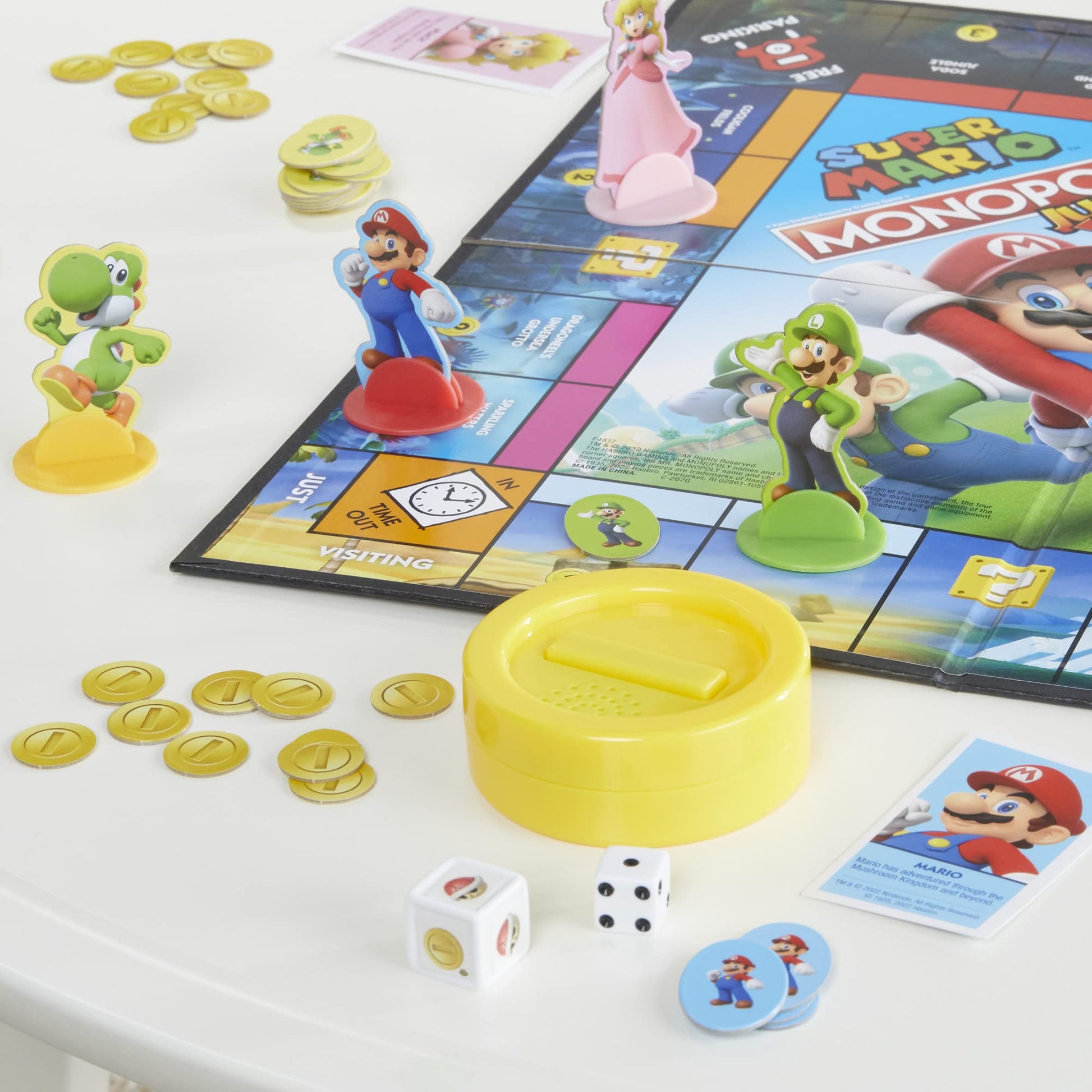 Monopoly Junior Super Mario Edition Board Game, Fun Kids' Ages 5 and Up, Explore The Mushroom Kingdom as Mario, Peach, Yoshi, or Luigi (Amazon