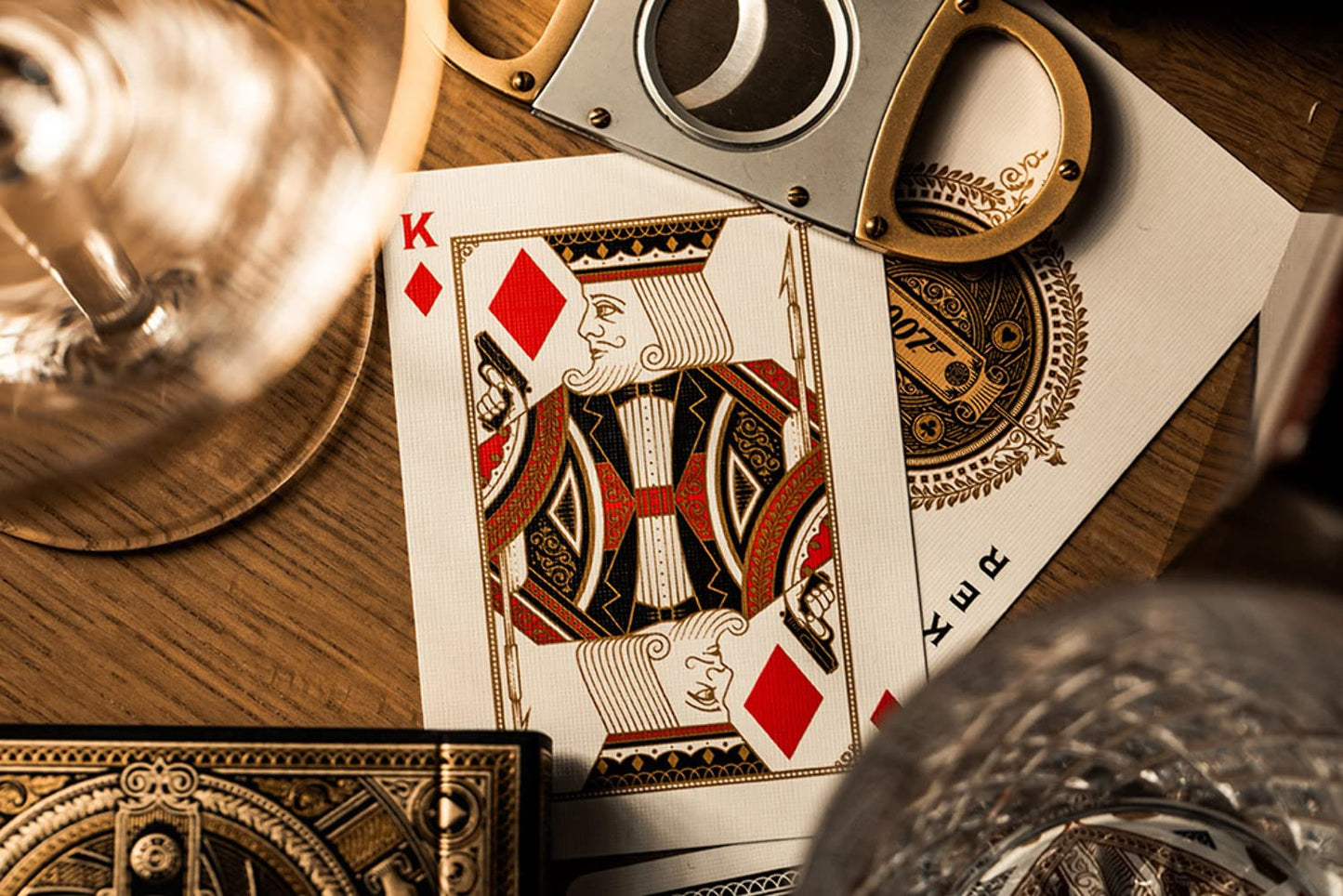 theory11 James Bond 007 Playing Cards - Gold Foil Spy Movie Poker Deck with Custom Aces, Jokers & Court Art for Magic, Cardistry, Game Night, Gifts