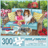 Bits and Pieces - 300 Piece Jigsaw Puzzle for Adults - Story Time - Dog and Cat on The Patio Wicker Furniture Girl Book Jigsaw Puzzle by Artist Brooke