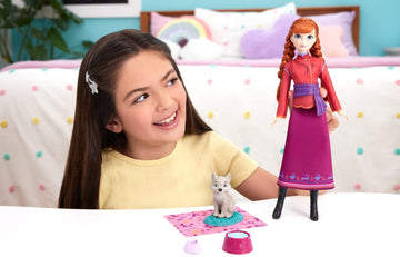Mattel Disney Frozen Anna Fashion Doll & Wolf Cub Figure with 4 Accessories Including Animal Bed & Blanket, Inspired by Animals of Arendelle