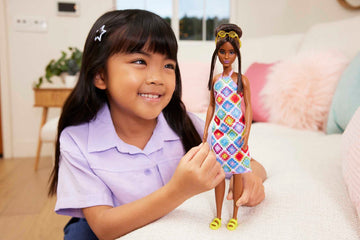 Barbie Fashionistas Doll #210 with Brunette Hair in Bun Wearing Removable Colorful Crochet Halter Dress, Sunglasses & Sandals