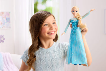 Mattel Disney Frozen Elsa Fashion Doll in Sparkling Removable Dress with Cape, Shoes and Braided Hair, Posable & Collectible, Inspired by Movie