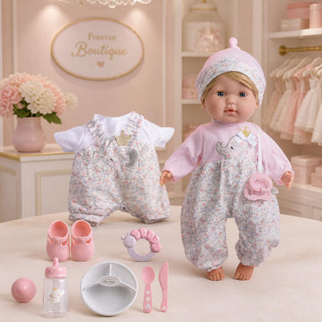 JC Toys Nonis Boutique 15" Realistic Soft Body Baby Doll with Blonde Hair, Blue Eyes, Open/Close Eyes | 10 Piece Gift Set with Bottle, Rattle
