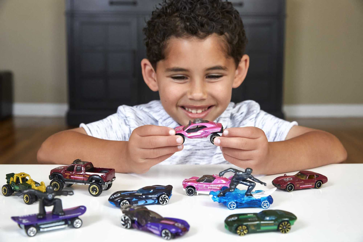 Hot Wheels Tokyo 2020 Olympics 10 Castings in 1 Pack Features 1:64 Scale Cars with Popular Sports Themes Treasure Hunt Car Collectible Ages 3