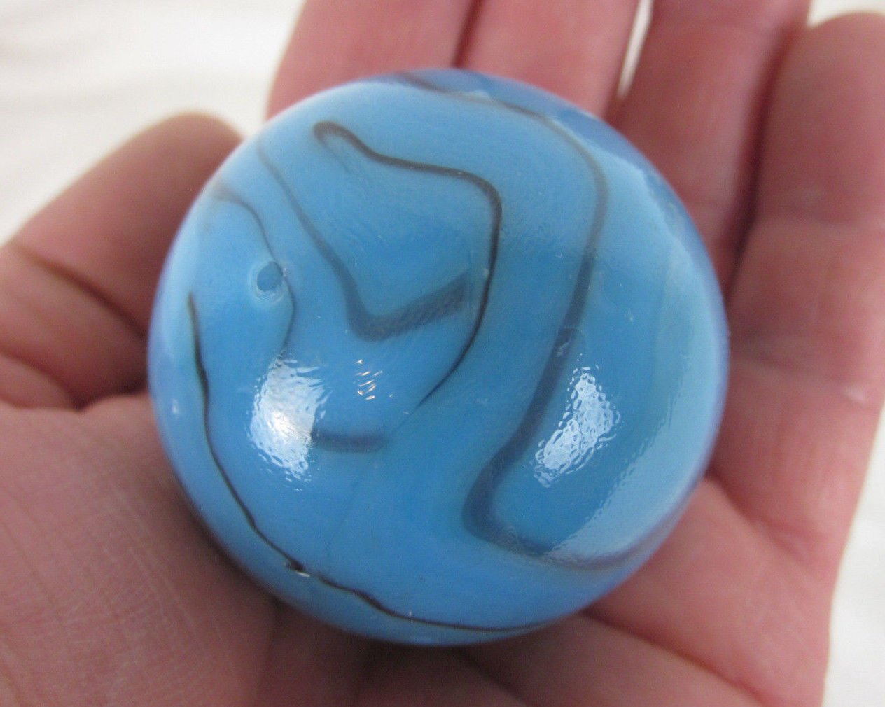 Big Game Toys Large 2" (50mm) Brontosaurus Toe Breaker Blue on Blue Swirl Glass Marble w/Stand