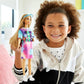 Barbie Fashionistas Doll, Petite, with Light Brown Hair Wearing Tie-Dye T-Shirt Dress, White Shoes & Visor, Toy for Kids 3 to 8 Years Old