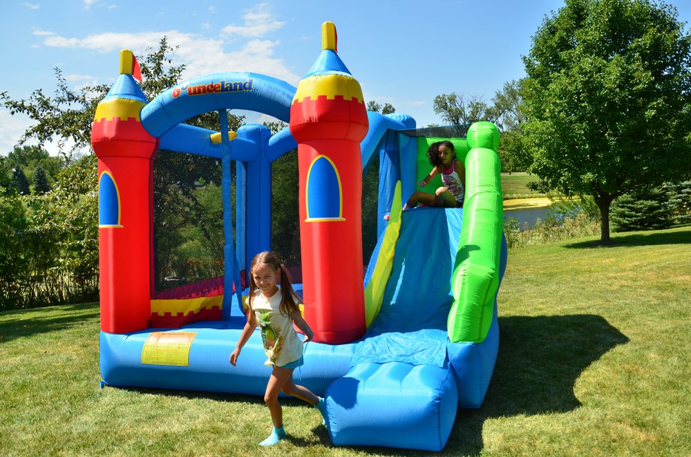 Bounceland Royal Palace Inflatable Bounce House, with Long Slide, Large Bouncing Area, Basketball Hoop and Sun Roof, 13 ft x 12 ft x 9 ft H, UL Strong