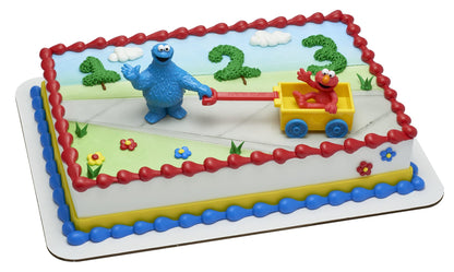 DecoSet® Sesame Street® Let's Play Cake Topper, 2-Piece Birthday Cake Decoration with Cookie Monster and Elmo in a Free-Wheeling Wagon, Ready to Use