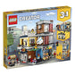 LEGO Creator 3 in 1 Townhouse Pet Shop & Café 31097 Toy Store Building Set with Bank, Town Playset with a Toy Tram, Animal Figures and Minifigures
