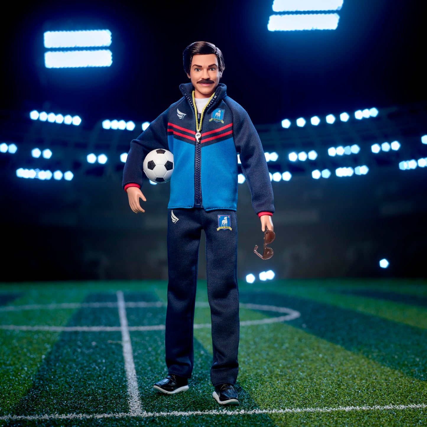 Barbie Signature Fashion Doll, Ted Lasso Wearing Blue Tracksuit with AFC Richmond Logo, Collectible in Displayable Packaging