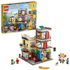 LEGO Creator 3 in 1 Townhouse Pet Shop & Café 31097 Toy Store Building Set with Bank, Town Playset with a Toy Tram, Animal Figures and Minifigures