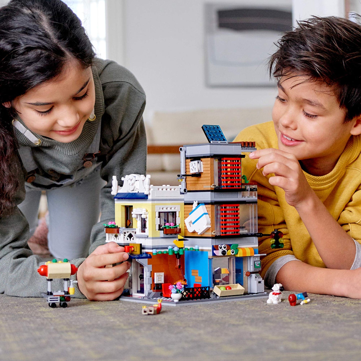 LEGO Creator 3 in 1 Townhouse Pet Shop & Café 31097 Toy Store Building Set with Bank, Town Playset with a Toy Tram, Animal Figures and Minifigures