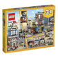 LEGO Creator 3 in 1 Townhouse Pet Shop & Café 31097 Toy Store Building Set with Bank, Town Playset with a Toy Tram, Animal Figures and Minifigures