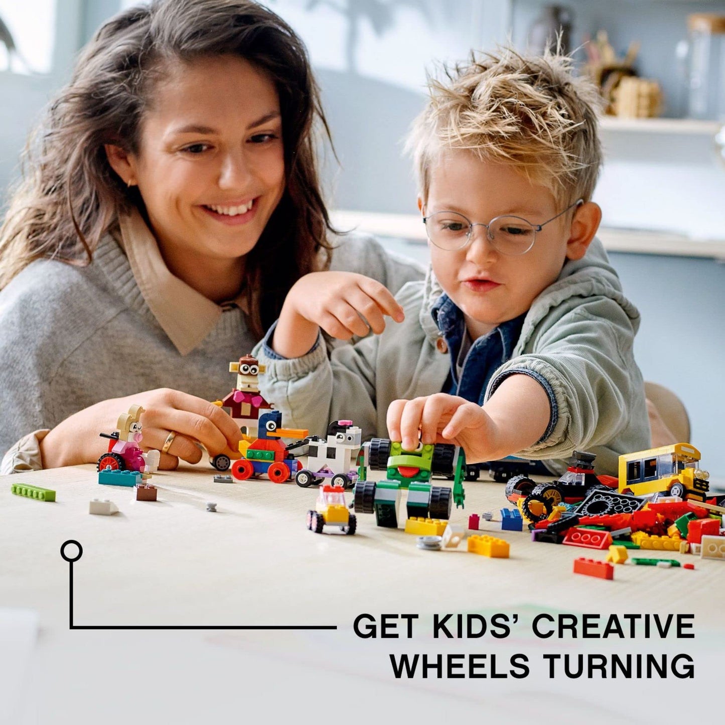 LEGO Classic Bricks and Wheels 11014 Building Kit, Includes a Toy Car, Train, Bus, Robot, Skateboarding Zebra, Race Car, Bunny in a Wheelchair,
