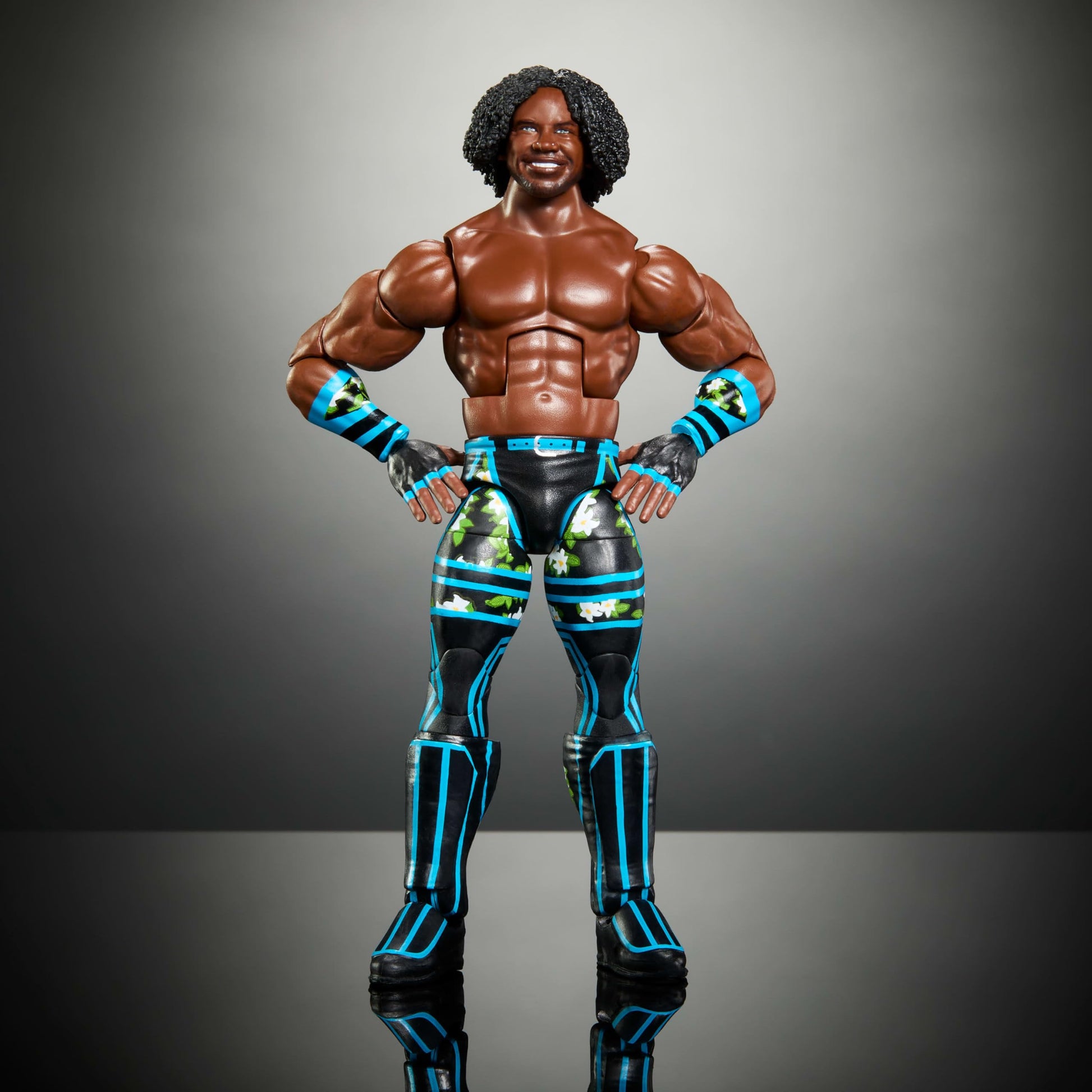 Mattel WWE Elite Action Figure & Accessories, 6-inch Collectible Xavier Woods with 25 Articulation Points, Life-Like Look & Swappable Hands