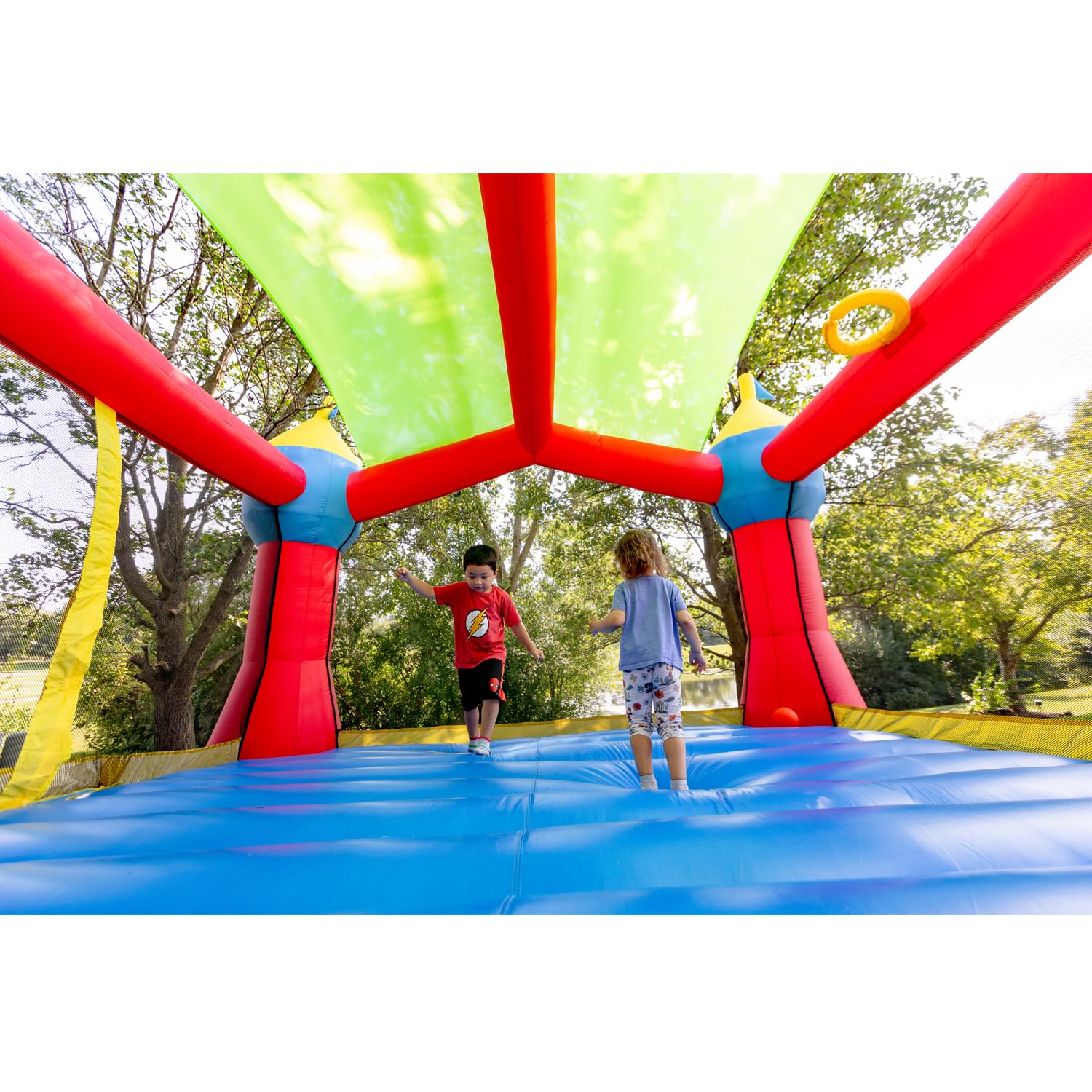 Bounceland Inflatable Party Castle Bounce House Bouncer, 16 ft L x 13 ft W x 10.3 ft H, Basketball Hoop, Removable Sun Roof, UL Strong Blower