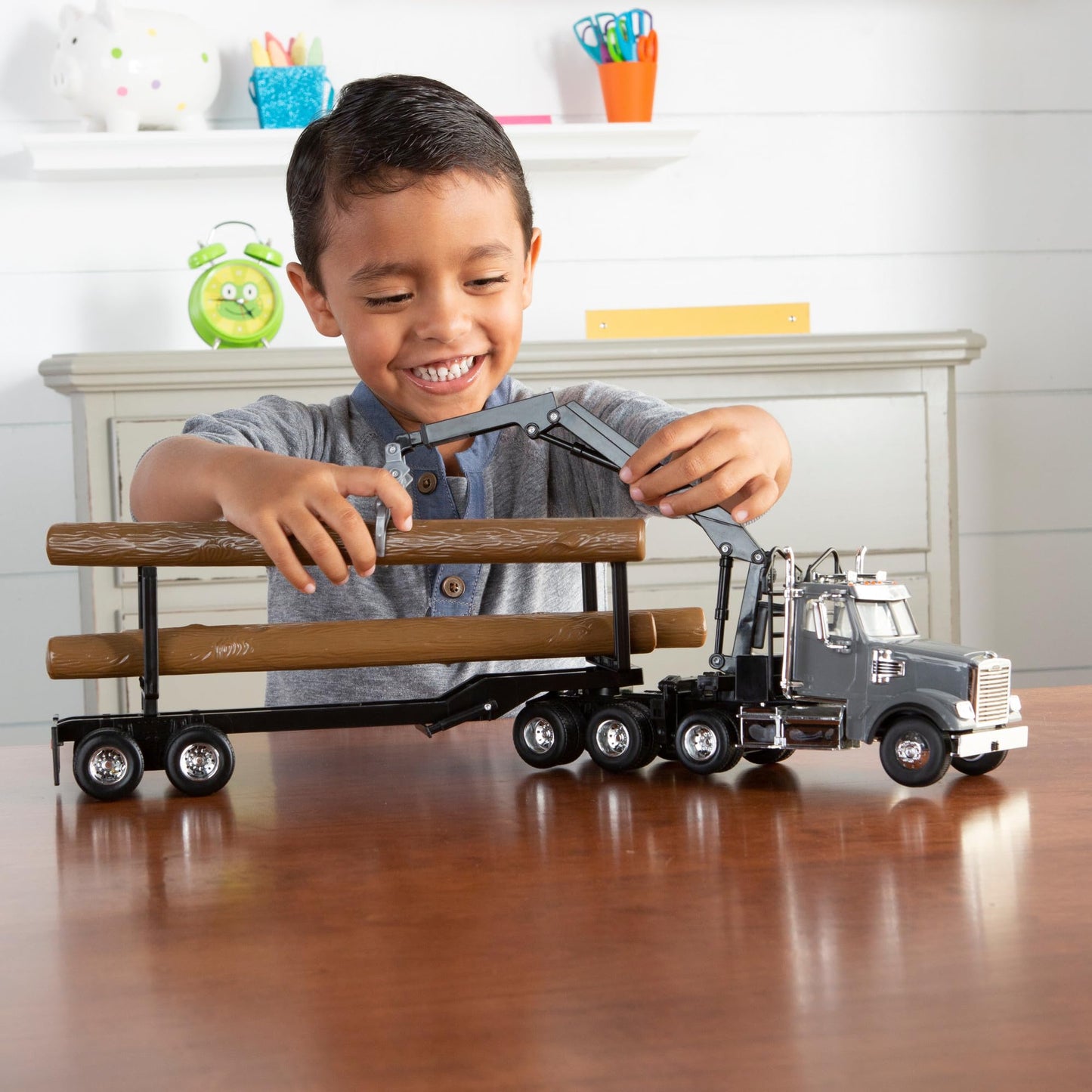 TOMY Freightliner 122SD Logging Truck Toy - 1:32 Scale - Includes Toy Truck, Trailer, and 3 Logs - Construction Truck Toys - Ages 3 Years and Up