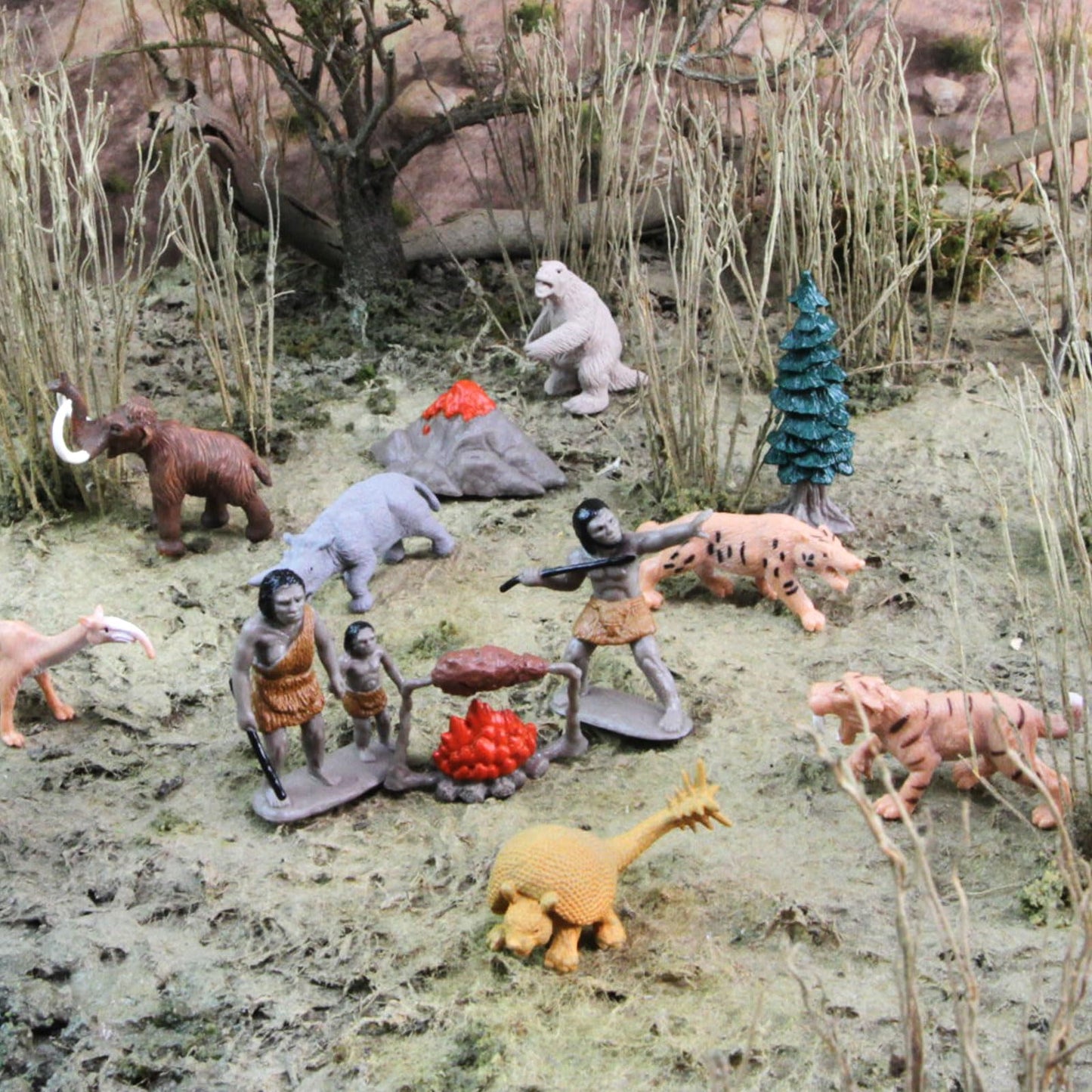 Safari Ltd. Prehistoric Life TOOB - 12 Figurines: Caveman, Cavewoman, Volcano, Mammoth, Doedicurus, Smilodon, Sloth, Dinosaurs - Educational Toy