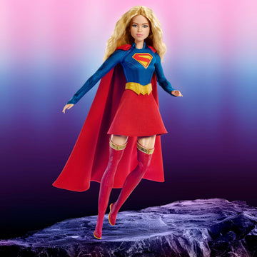 Barbie Signature DC Supergirl Fashion Doll, Blonde with Super Hero Costume & Cape, Collector Doll in Displayable Packaging & Doll Stand