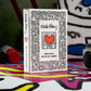 theory11 Keith Haring Playing Cards - Pop Art Poker Deck with Bold Character Artwork, Magic, Cardistry, Game Night Gift for Art Lovers, Card