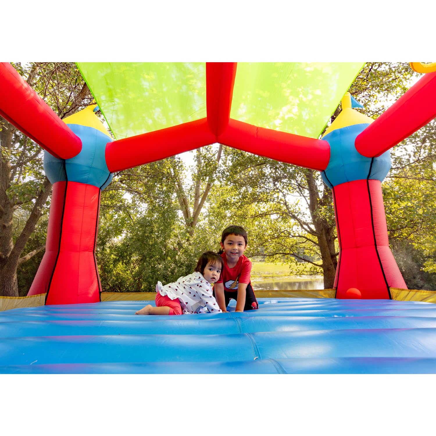 Bounceland Inflatable Party Castle Bounce House Bouncer, 16 ft L x 13 ft W x 10.3 ft H, Basketball Hoop, Removable Sun Roof, UL Strong Blower