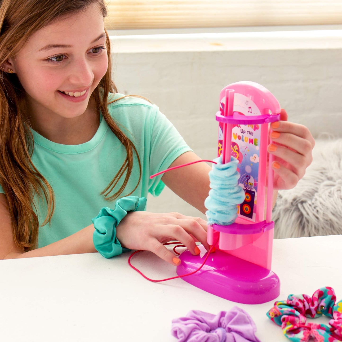 Trolls World Tour Scrunchie Maker by Horizon Group USA. Create 12 Personalized Trolls Hair Scrunchies. Mix & Match Fun Fabrics. Glue in Fun Sequins