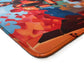 Foxtrot Designs TCG Playmat, 24in x 14in, Premium Stitched Edges, Non-Slip Base for MTG and Other Trading Card Games. MTG Playmat. (District 10)
