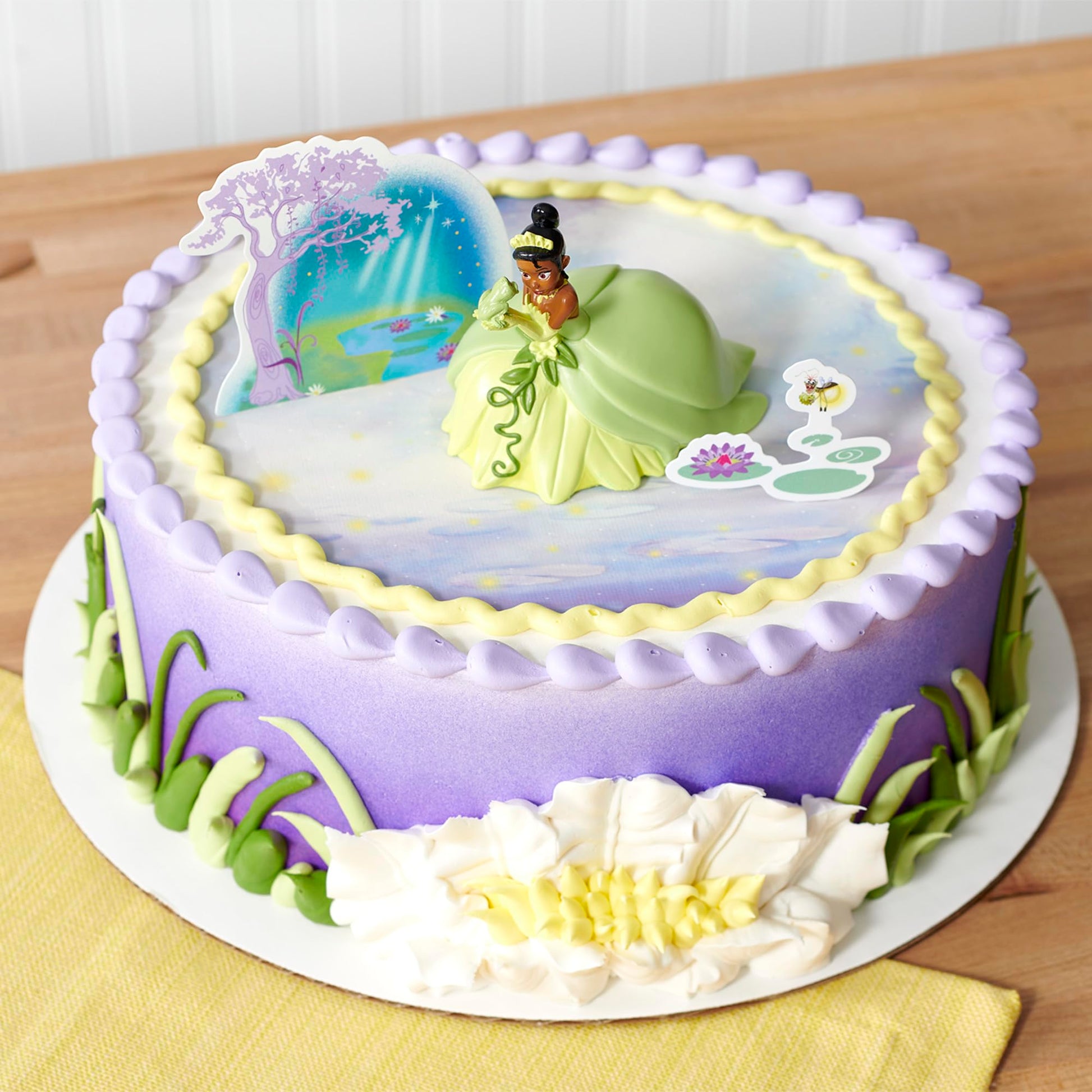 DecoSet® Disney Princess Tiana Cake Topper, 3-Piece Cake Decoration With Tiana And Frog Figurine, Water Lily Pic, And Background Scenery Pic