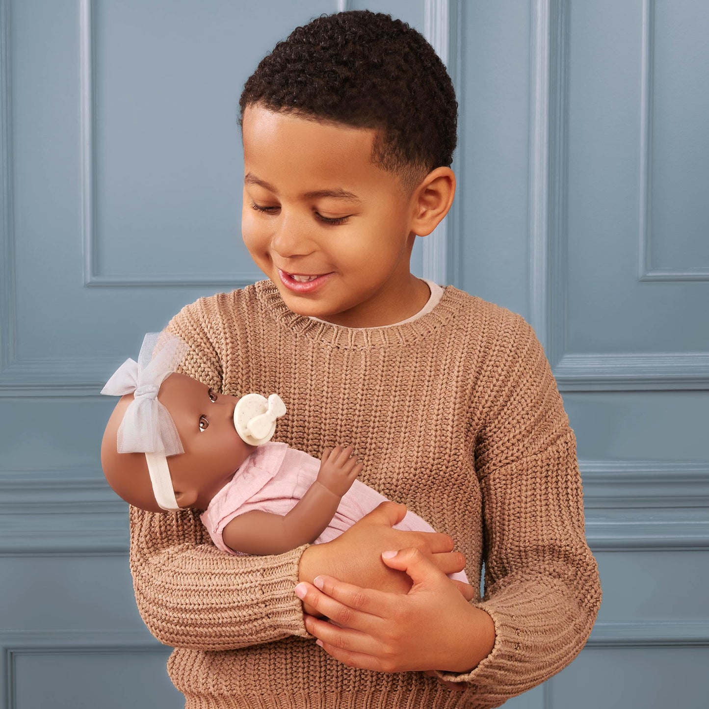 LullaBaby - 14-Inch Realistic Baby Doll - Brown Eyes, Warm Skintone & Soft Huggable Body - Pink Jumper Outfit with Bow Headband - Removable Clothes