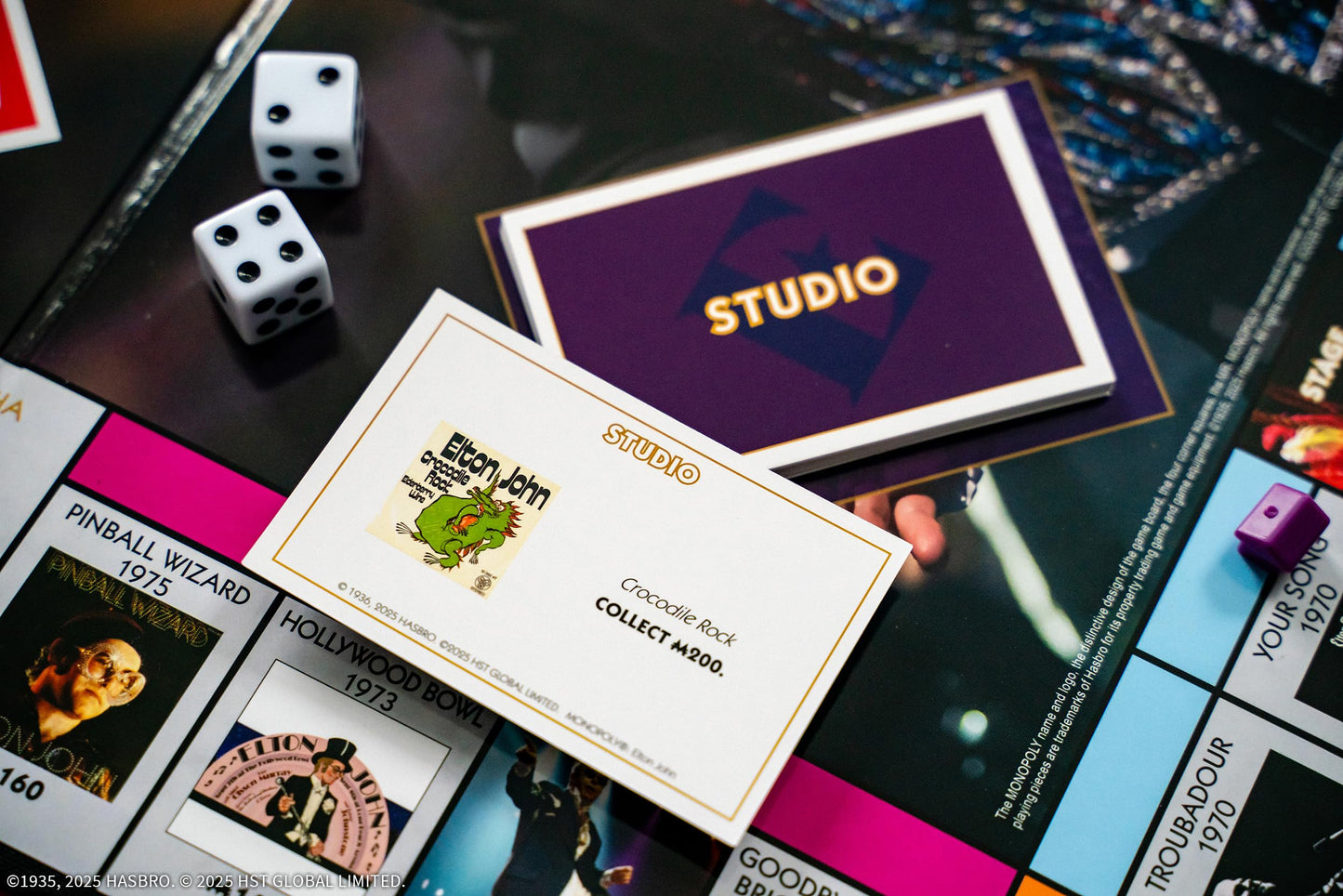 Monopoly: Elton John, Play as Iconic Headgear, Star Glasses & More, Collect Legendary Career Moments Like Knighthood & Farewell Tour, Officially