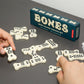 Kikkerland Bones Bone Shaped Domino Set, Classic Board Game, 28 Tiles, Fun Family-Friendly Game Night, for Adults and Kids Ages 8 and Up