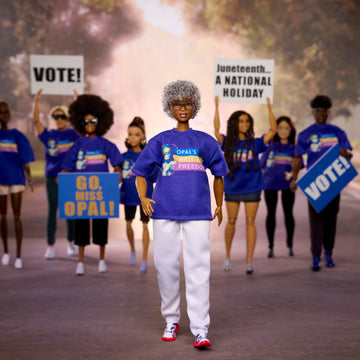 Barbie Inspiring Women Doll, Opal Lee Collectible in Blue “Opal’s Walk for Freedom” T-Shirt, White Pants and Glasses, Doll Stand and Displayable