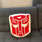 Symbiote Studios Transformers - Autobot Logo Plush Cushion - Officially Licensed Product, Soft and Cuddly Collectible for Fans and Collectors - Ideal