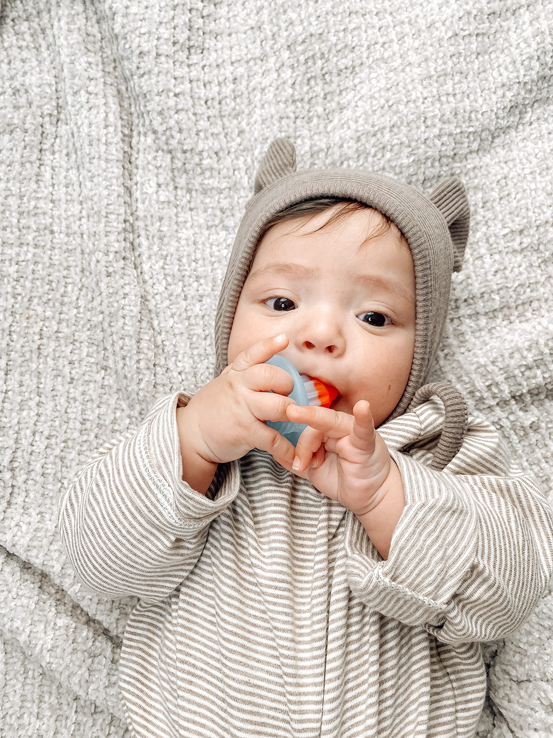 Itzy Ritzy Silicone Teensy Teether - Flexible, Soft & Hollow Baby Teething Toy with Easy-to-Hold Handle - Designed for Ages 3 Months and Up (Hero Pop)