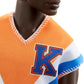 Barbie Fashionistas Ken Fashion Doll with Twisted Black Hair Wearing Orange Athletic Jersey, Shorts & White Sneakers