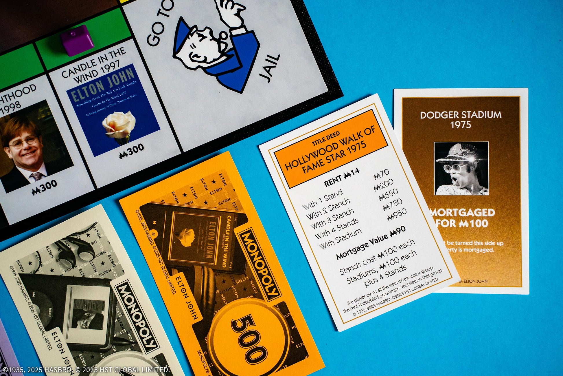 Monopoly: Elton John, Play as Iconic Headgear, Star Glasses & More, Collect Legendary Career Moments Like Knighthood & Farewell Tour, Officially