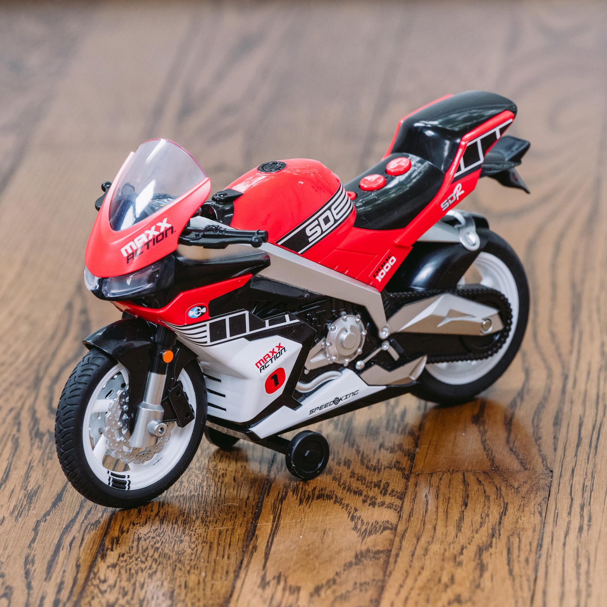 Sunny Days Entertainment Maxx Action Super Bike with Wheelie Feature - Red Motorized Toy Motorcycle for Boys & Girls | Light & Sound Vehicle for Kids